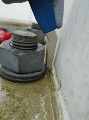 Non destructive testing performed by Sonomatic RAIS Rope Access and Inspection Services Technicians on wind turbine flanges using a bespoke pencil probe